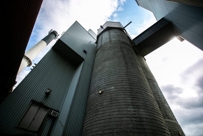 Towers storing material for boilers raise high into the skyline at the University of Iowa Power Plant