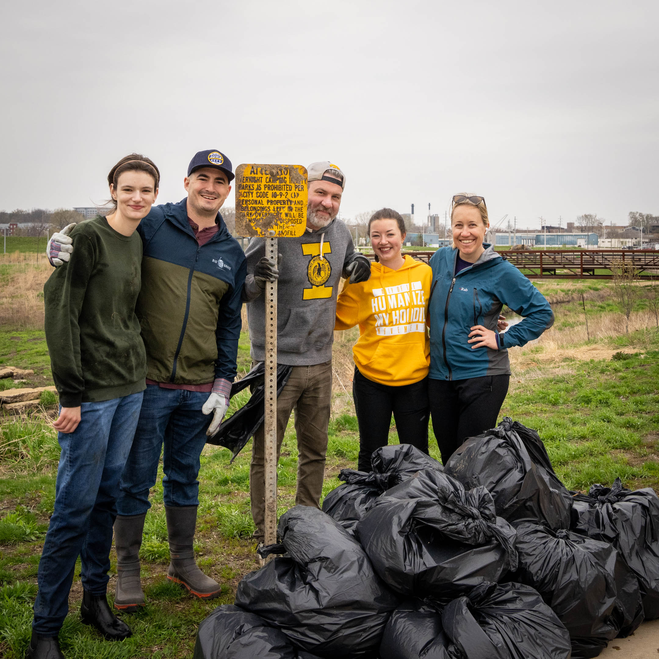 Group of Big Grove employees and administrators participate in an Earth Day cleanup.