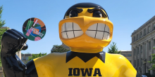 Herky holding a promise sign