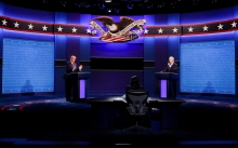 Trump and Biden stand at podiums at debate