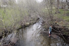 creek with guy on edge