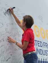 Governor Reynolds signs wind turbine blade for wind week