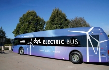 bus with logo, dart Electric Bus, sitting in parking lot 