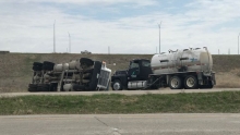 semi rolled over off side of road causing fertilizer spill