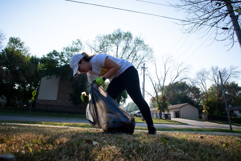 Volunteer picking up trash