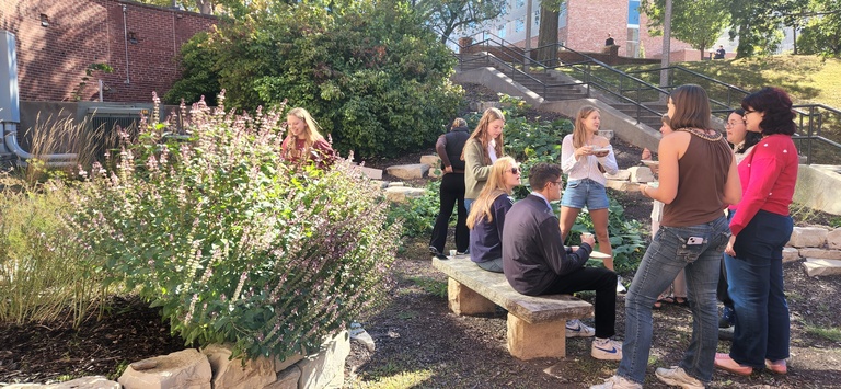 Students gather at the North Hall edible garden