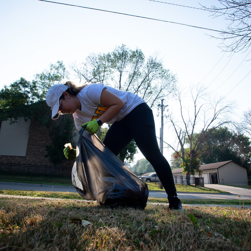Volunteer picking up trash