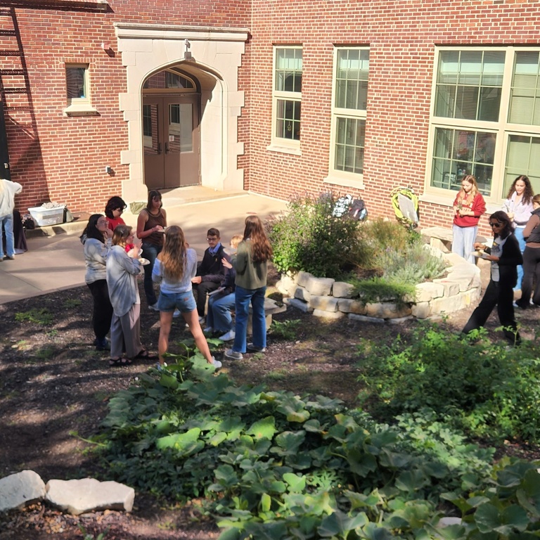 Students gather at the North Hall edible garden