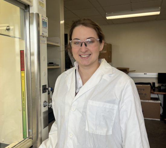 Josie Welker, GPSG Sustainability Director, placed a Shut the Sash sticker on a fume hood.