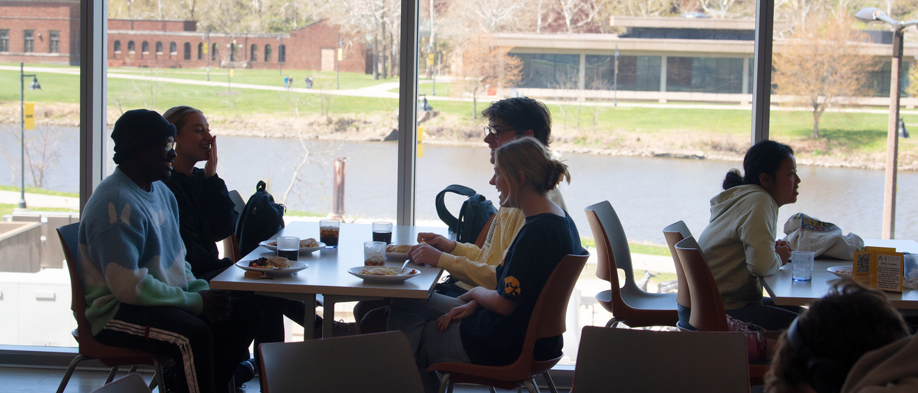 Students eating lunch at Catlett Market Place with view of river in background