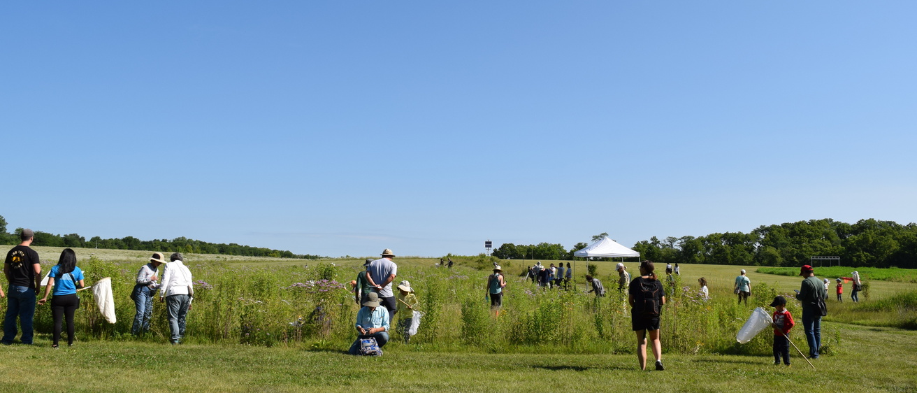Group of people observing and exploring Ashton Prairie