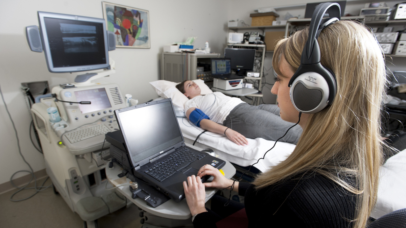 Doctor with patient at computer